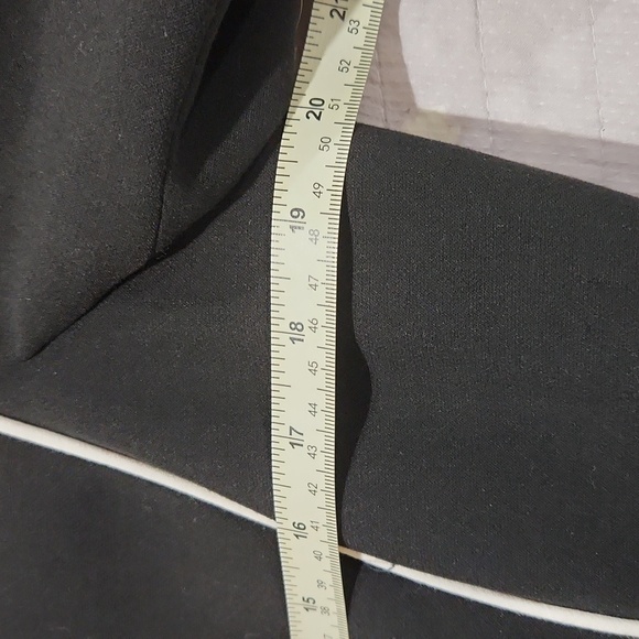 Classic black Tahari blazer with white trim, zipper pockets and sleeves. - Picture 6 of 12